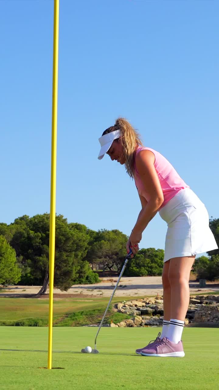 Woman playing golf on a sunny day