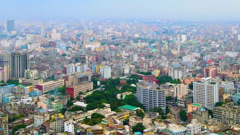 megacity of dhaka with green parks in middle, aerial drone view