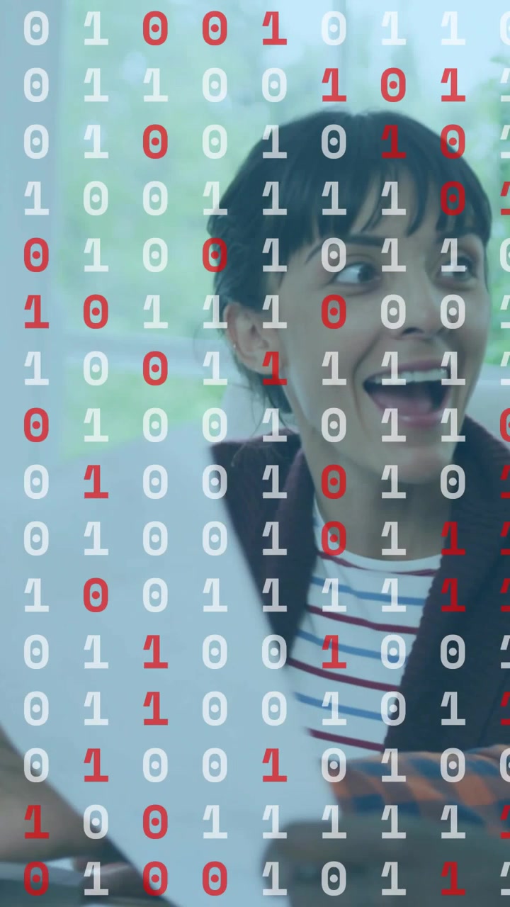 Vertical video: Woman reacting to man showing phone, laughing as binary code overlaying tech