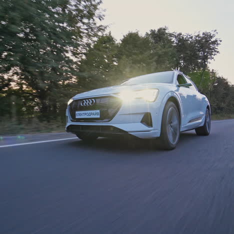 audi e-tron first all-electric suv car. presentation of a new car model. fast driving drifting in city
