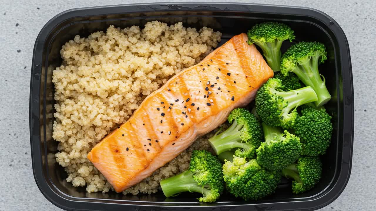 Delicious and Nutritious Meal Prep: Grilled Salmon Fillet with Steamed Broccoli and Quinoa for a Healthy Diet Option