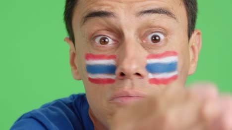man with thai national flag upset with a referee
