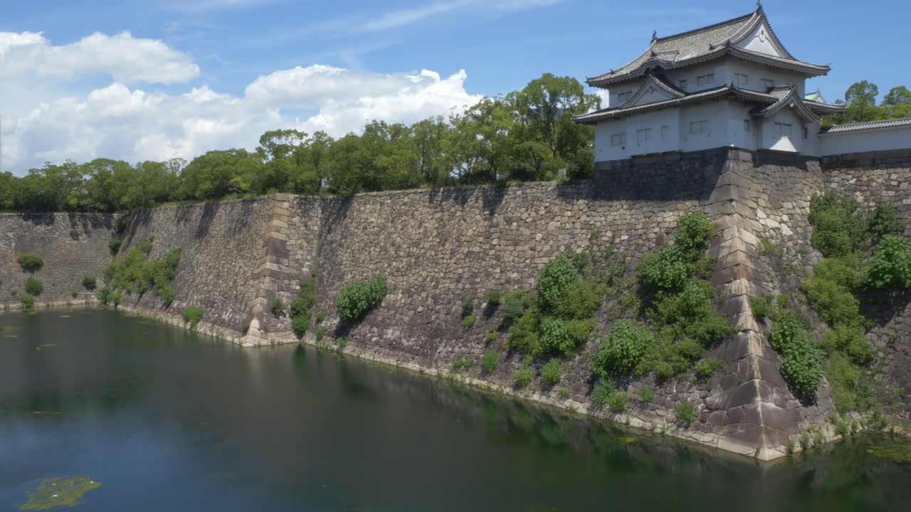 Rokuban-yagura Turret Towering Over Stone Walls Within Osaka Castle Park In Osaka, Japan. Aerial Drone Shot