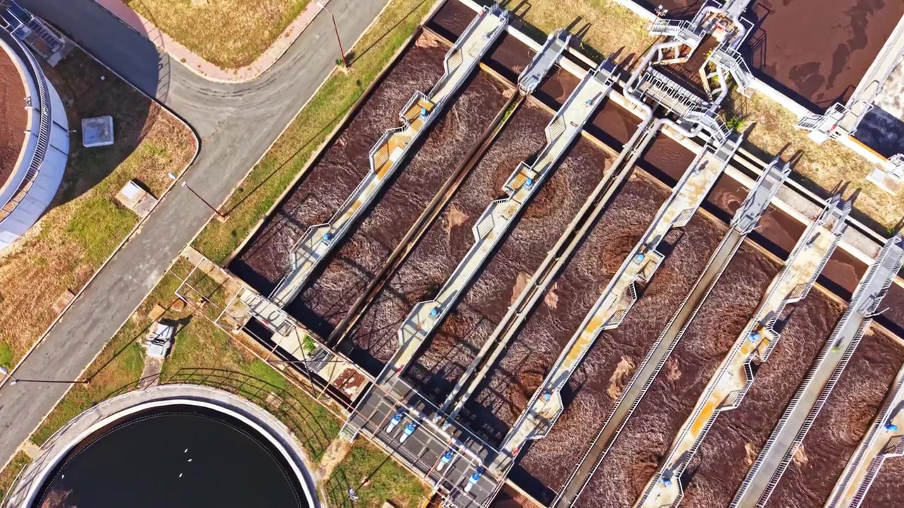 Water treatment facility shows multiple tanks and equipment used for managing water quality