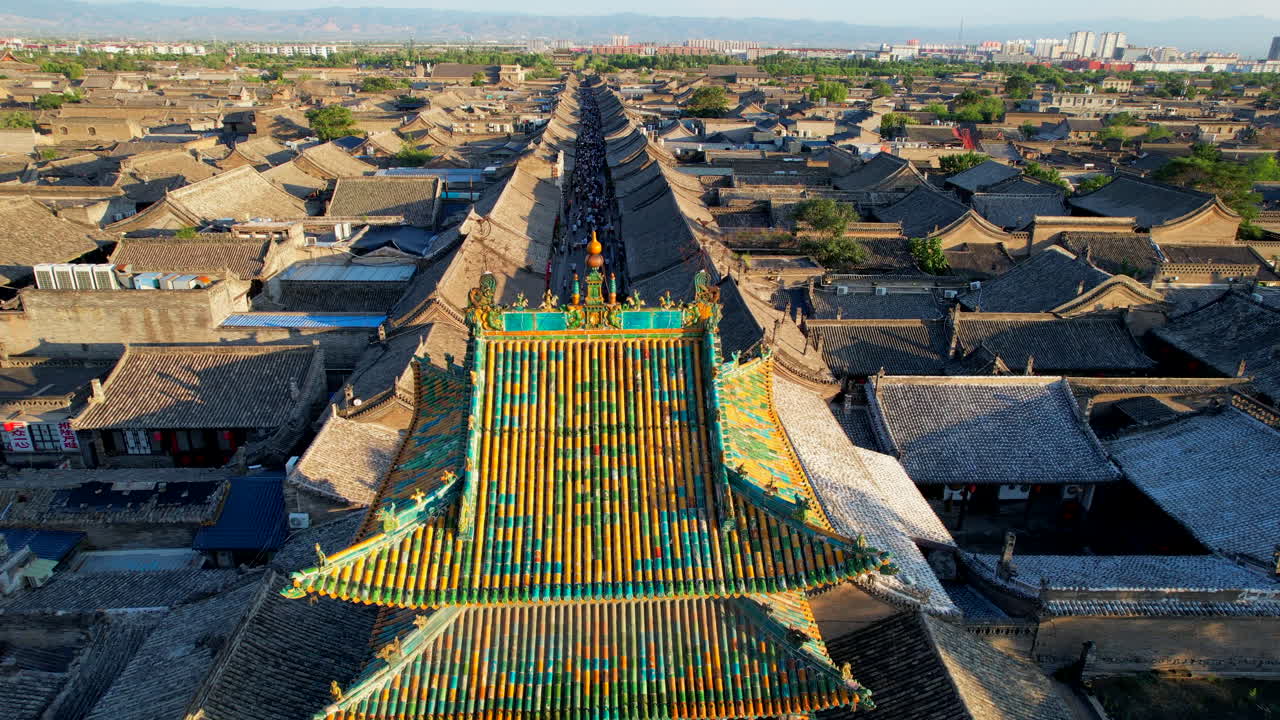 Typical ancient Chinese architecture of Pingyao Old town, crowded streets, aerial