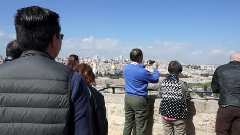 tourists at a jerusalem viewpoint