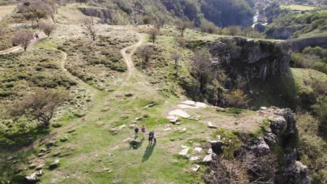 aerial view of people standing near edge of cliff at cheddar gorge