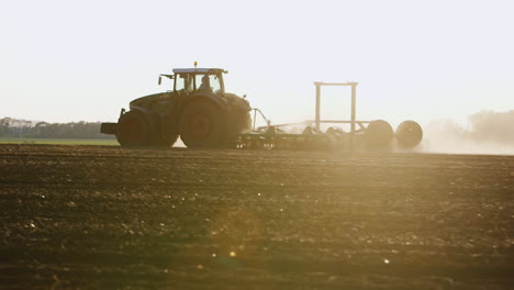 tractor plows through the soil 2