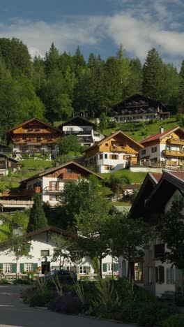 mittenwald, bavaria, germany - a picturesque village with charming wooden houses scattered across a hilly landscape - medium shot