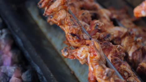 roasted chicken wings on a spit