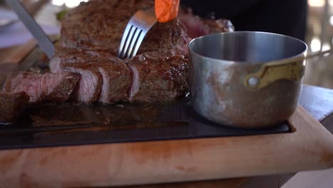 cutting beef juicy steak and the juices coming out.