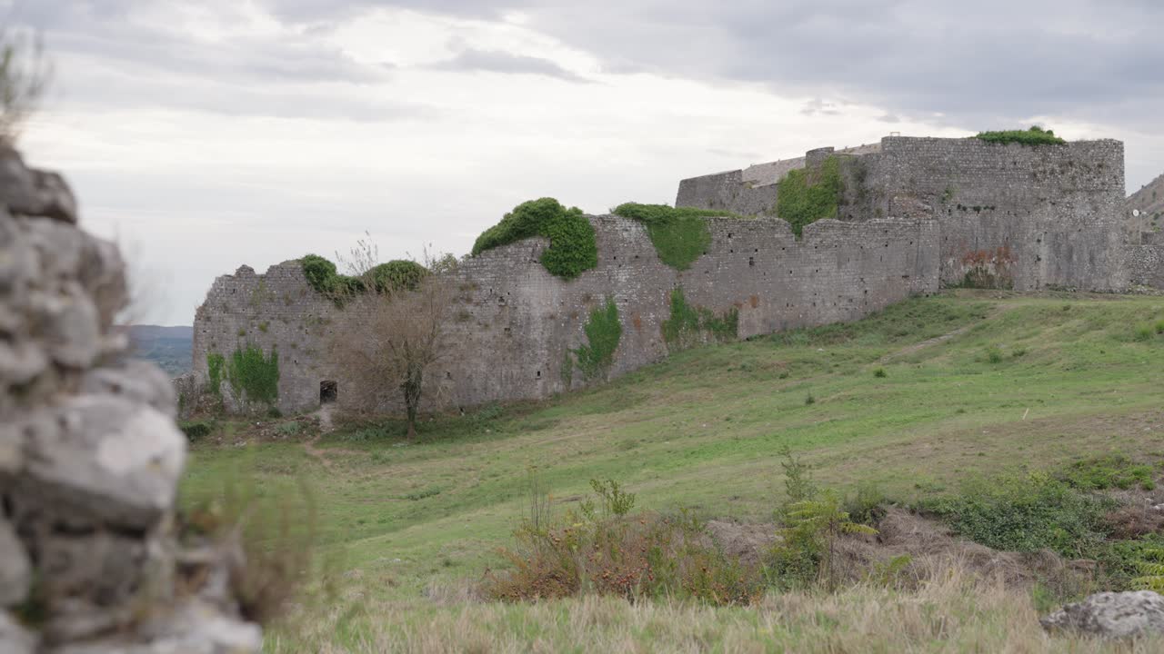 Historic stone walls of Rozafa Castle in Shkoder, Albania on a cloudy day