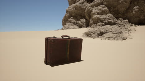 vintage suitcase abandoned in the desert