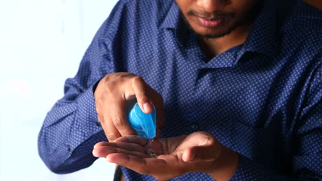 person applying hand sanitizer