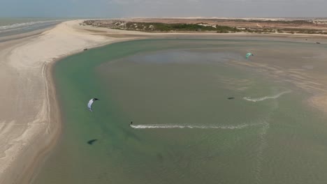 a kitesurfer cruising in the tatajuba lagoon