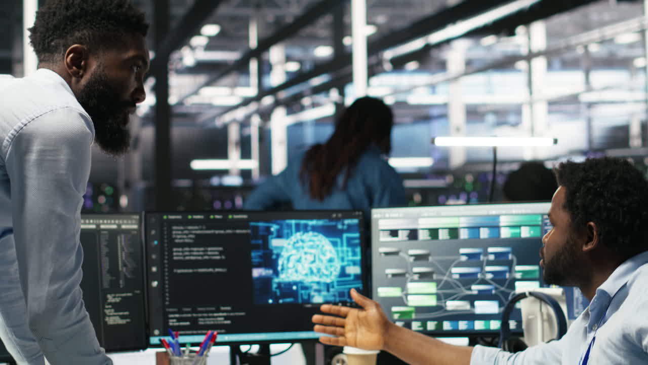 Technician in wheelchair and data center manager using AI node tree software