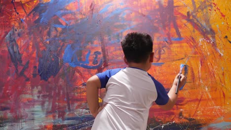 child painting on a wall
