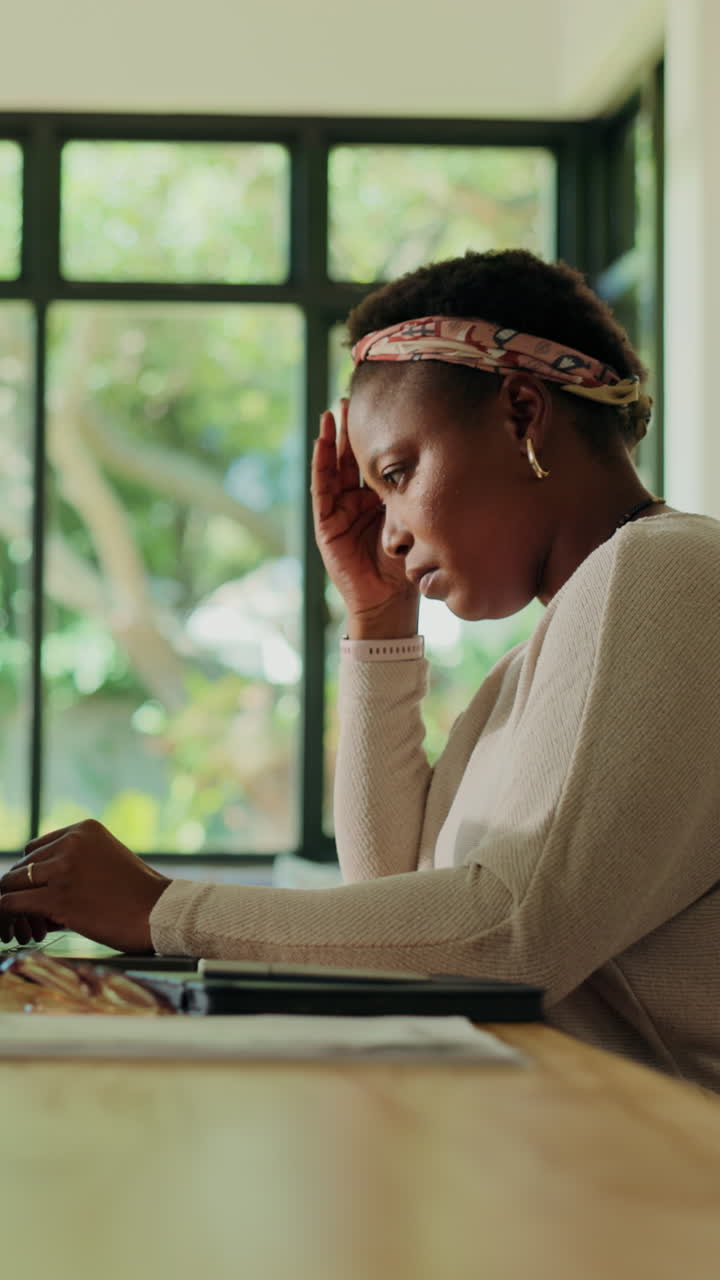 Stressed Young Black Woman Working on Laptop at Home