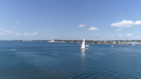 a sailboat catches the summer breeze near newport rhode island in this 4k 60fps drone shot