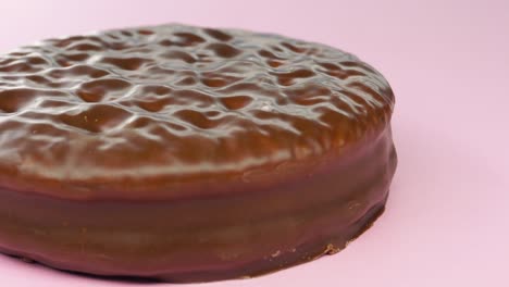 chocolate biscuits panning on pink background.4k macro detail