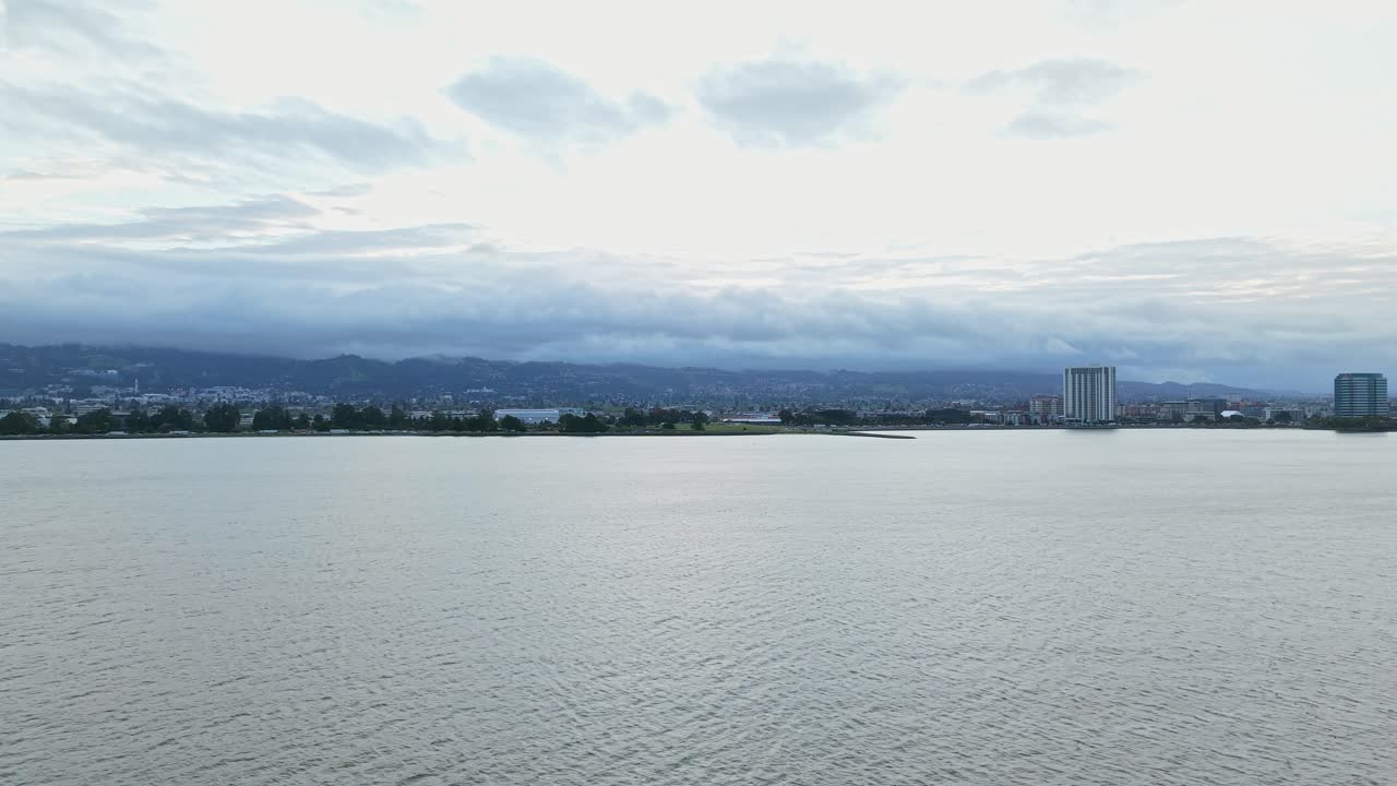 Aerial views of Emeryville shore and its inviting walking paths, waterfront location, and peaceful setting.