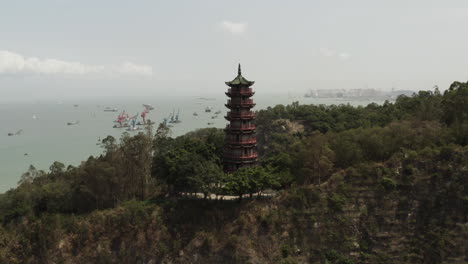 chinese pagoda on top of mountain near sea side