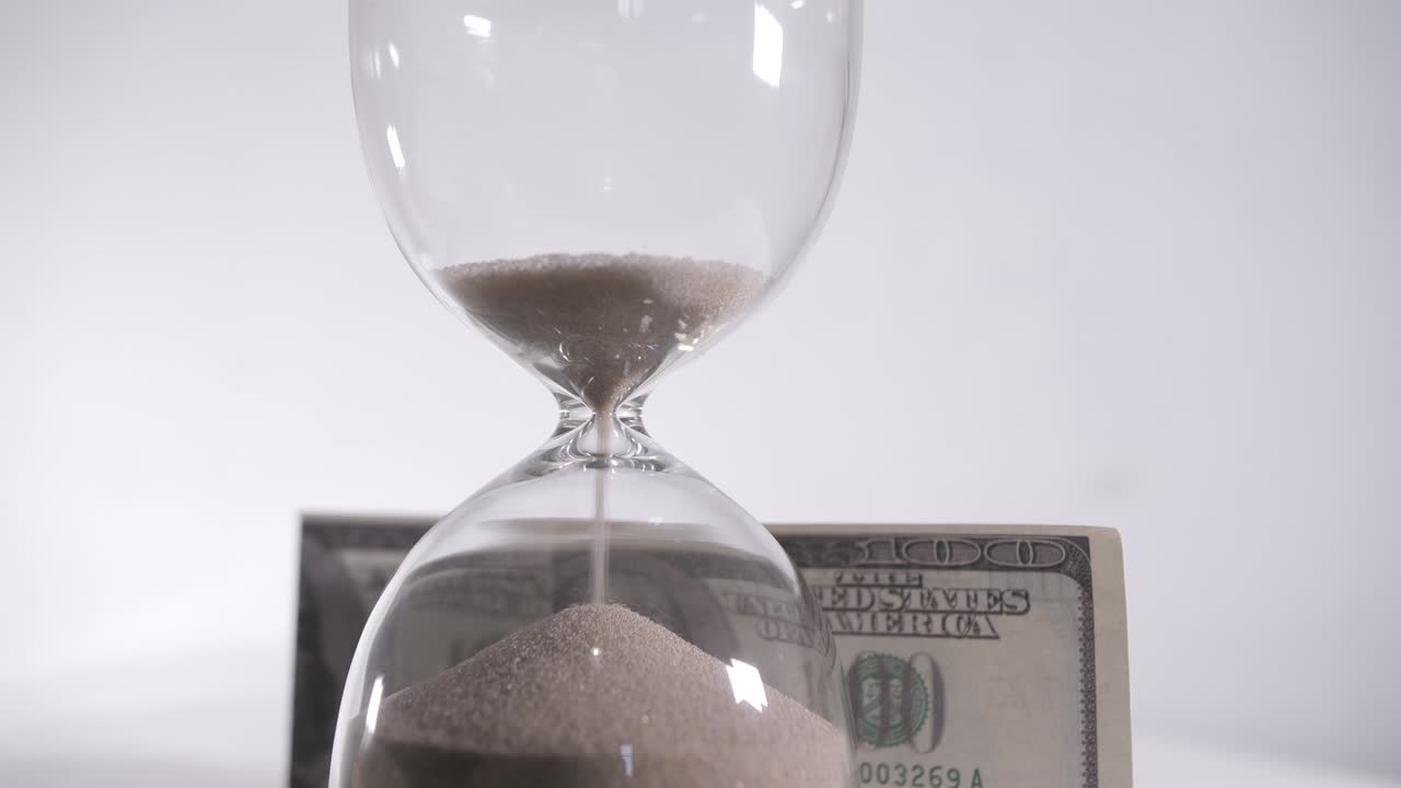 imágenes de dinero de reloj de arena