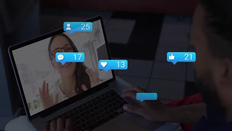 Animation-Von-Social-Media-Symbolen-Und-Zahlen-über-Einer-Kaukasischen-Frau-Bei-Einem-Laptop-Videoanruf