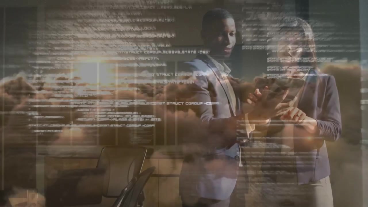 Man holding tablet and woman tapping screen, initiating cloud data overlay while reviewing metrics