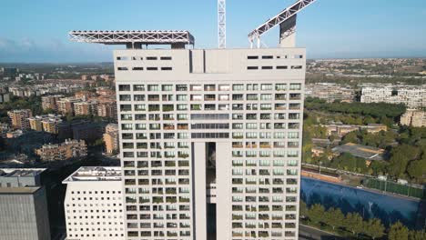 forward drone shot above eurosky tower - rome, italy skyscraper