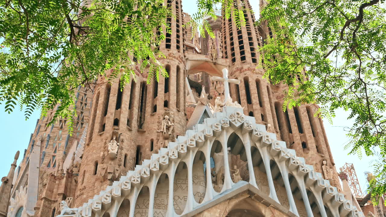 The Sagrada Familia, greenery and construction works in Barcelona, Spain