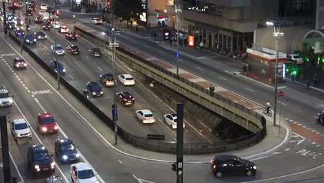 heavy traffic in paulista avenue at night, sao paulo city. zooming in high angle