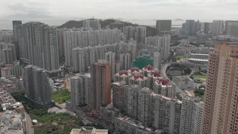 aerial drone shot of taipa highrise apartment buildings on cloudy day