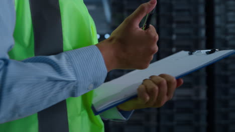 storekeeper counting boxes checking supply shipping process hands closeup