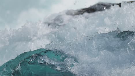 Slow-motion-shot-of-flowing-water-along-rapids-of-Loen-water-in-Norway-at-daytime