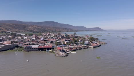 flight over the small town of petatan by the chapala lake in mexico