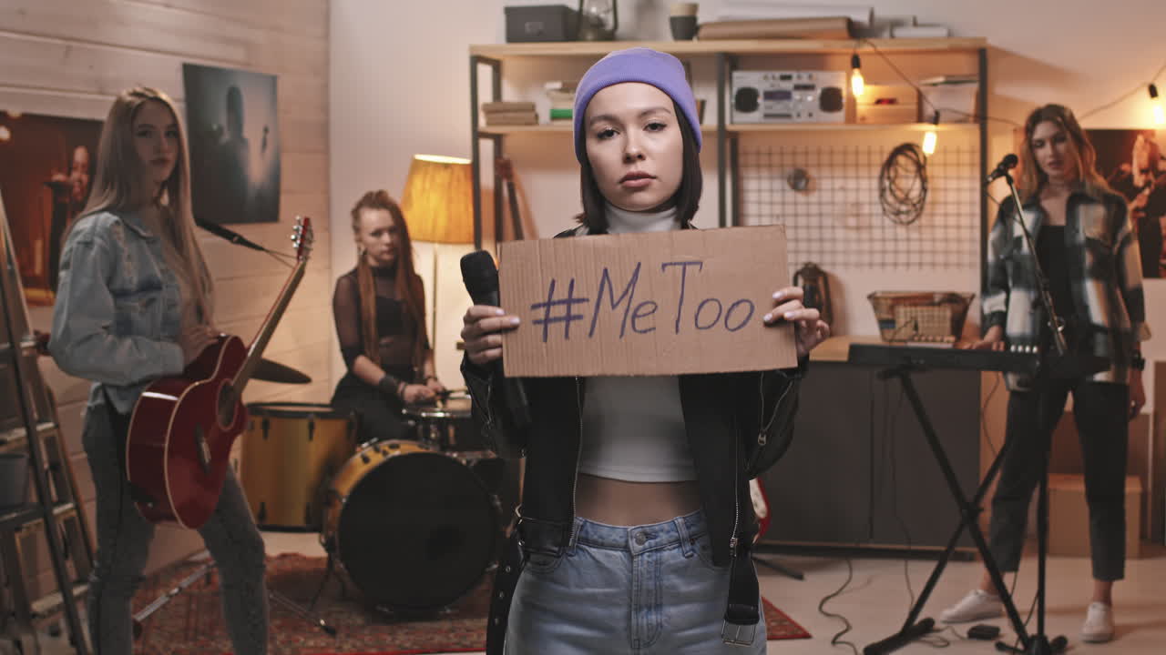 Female Rock Singer Holding MeToo Sign
