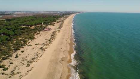 drone video descending over huelva beach a popular spanish tourist destination, in the daytime