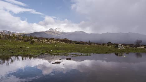 Time-lapse-of-some-clouds-over-snowy-mountains