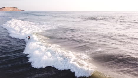 Surfer-Rides-A-Breathtaking-Wave-On-Turquoise-Ocean-Water-Of-Olon-Beach-In-Ecuador