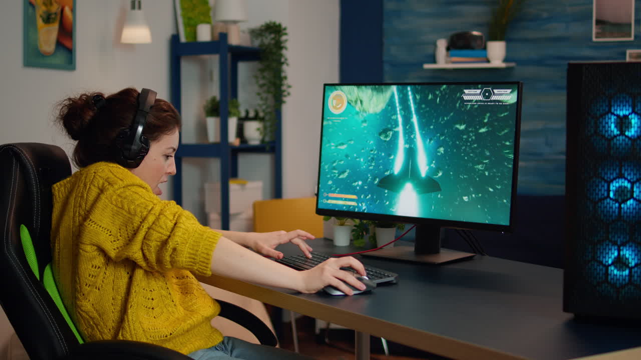 Back shot of happy gamer playing and winning space shooter