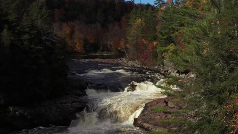 rapids-and-waterfall-ascending-view-in-fall-colored-forest-epic