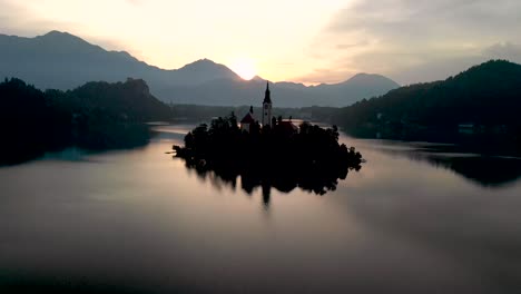 a beautiful reflection of lake bled at sunrise