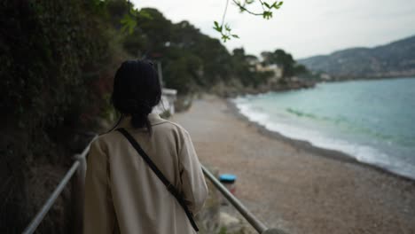 Girl-walking-on-beach-in-France