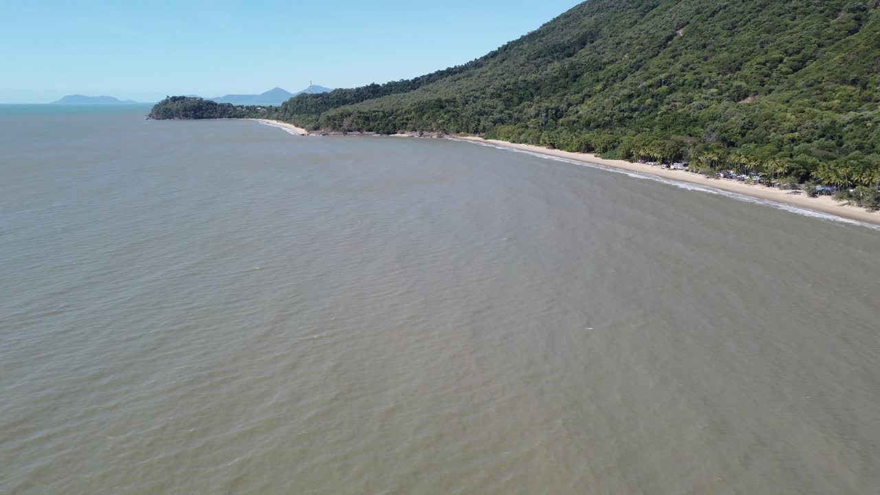 4K aerial view of a sandy beach and a peninsula in North Queensland, Australia