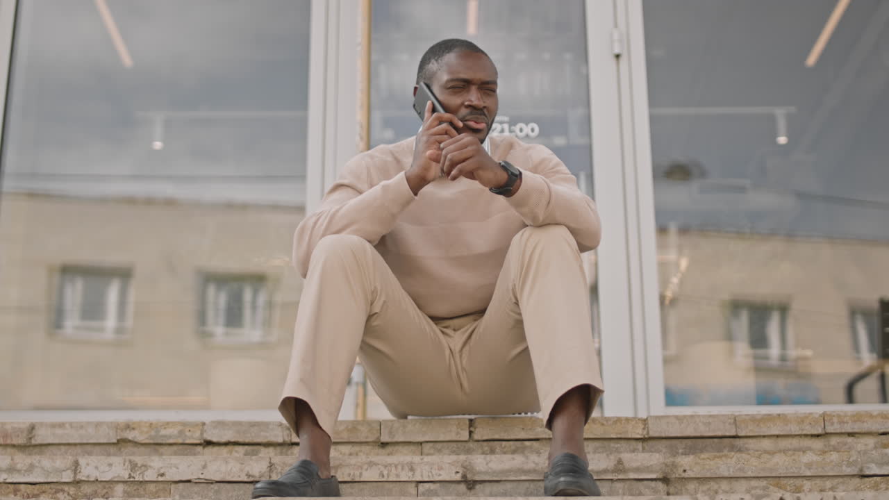 Smart African-American Man Making Phone Call Outdoors