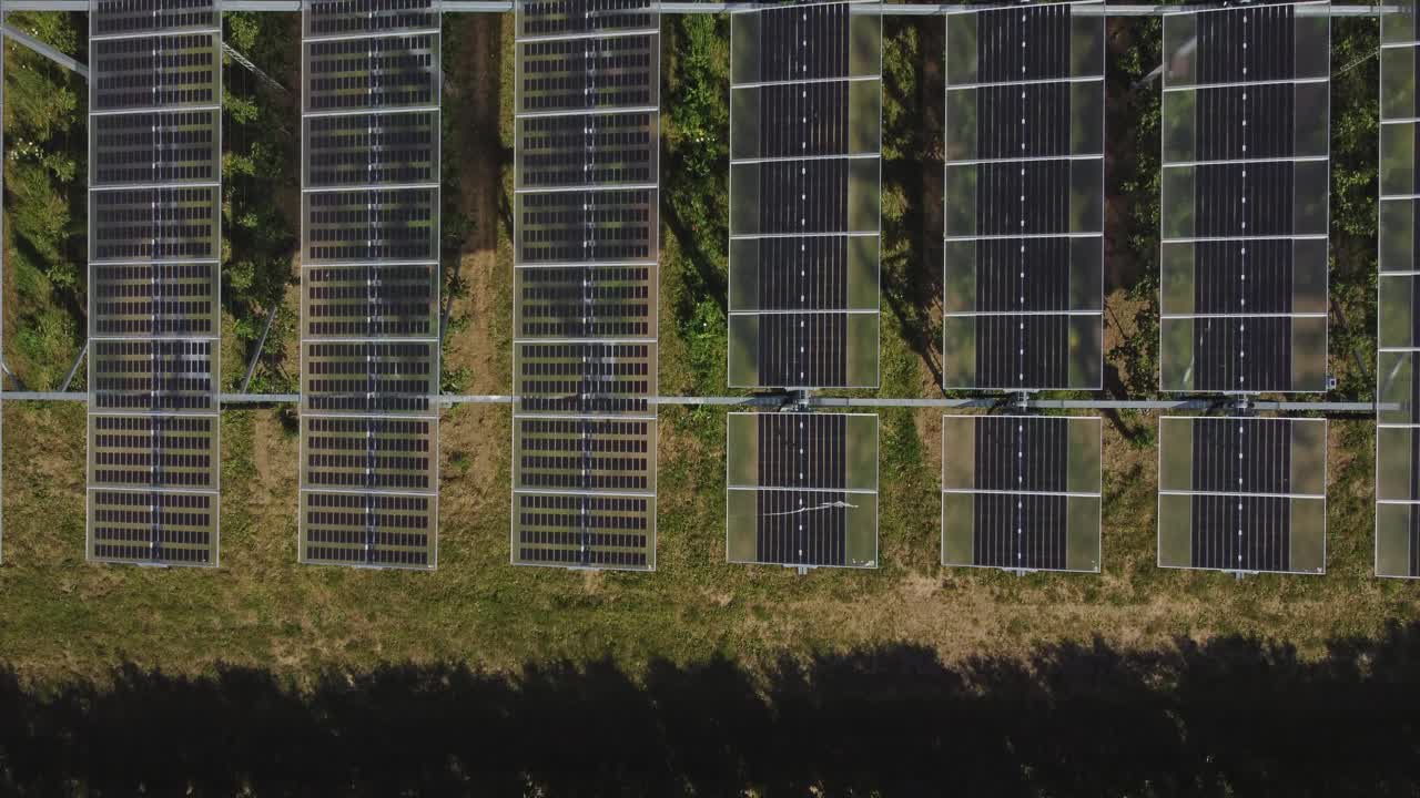 Top Down View Of Photovoltaic Panels In Agricultural Field - drone shot bird's eye