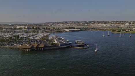 san diego california aerial v92 low flyover bay around harbor island capturing airport airfield, downtown cityscape and cruise ship sailing on the water - shot with mavic 3 cine - september 2022