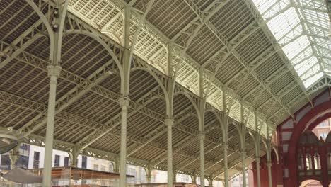 Details-of-the-metal-structure-of-the-roof-of-Colón-Market,-historic-landmark-in-Valencia,-Spain