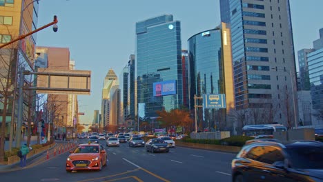 big asian city town in south korea, seoul, gangnam traffic with cars, buses, skyscrapers and big urban architecture